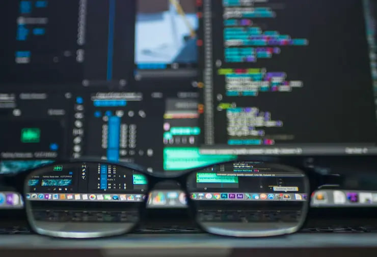 eyeglasses closeup nearby computer